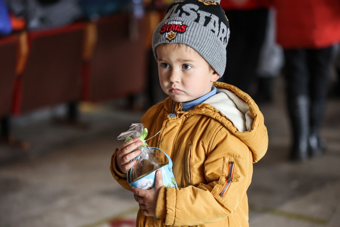 A Ukrainian Child Holding Candies Given Out By Volunteers A Ukrainian Child Holding Candies Given Out By Volunteers