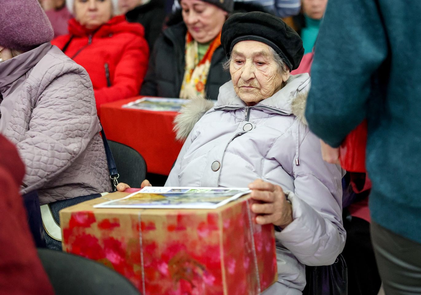 Senior Woman Sitting With Her Christmas Present Senior Woman Sitting With Her Christmas Present