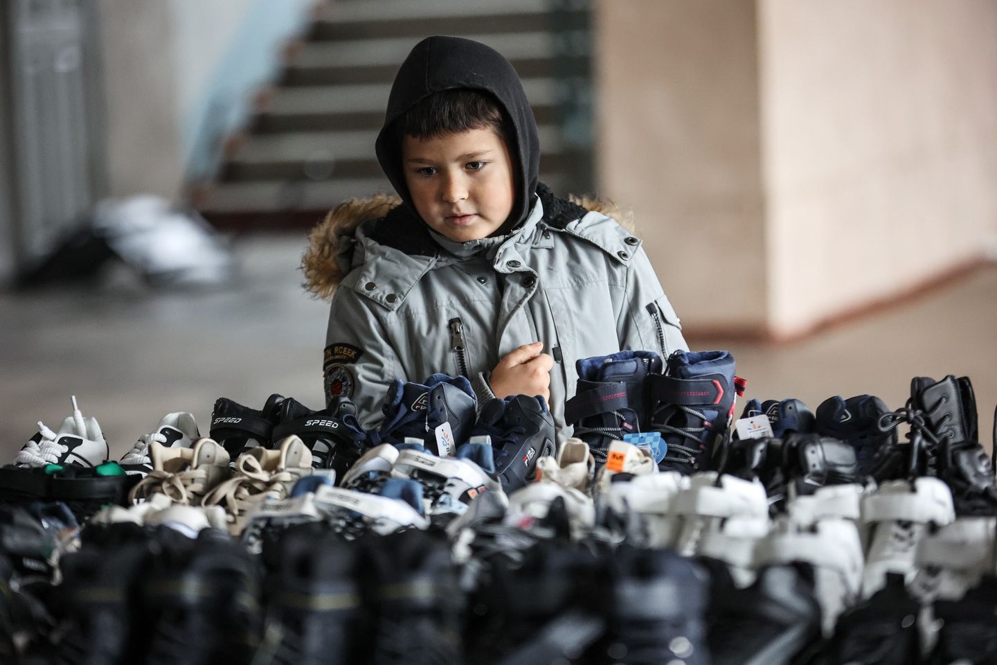 Ukrainian Boy Looking Over Shoes Ukrainian Boy Looking Over Shoes