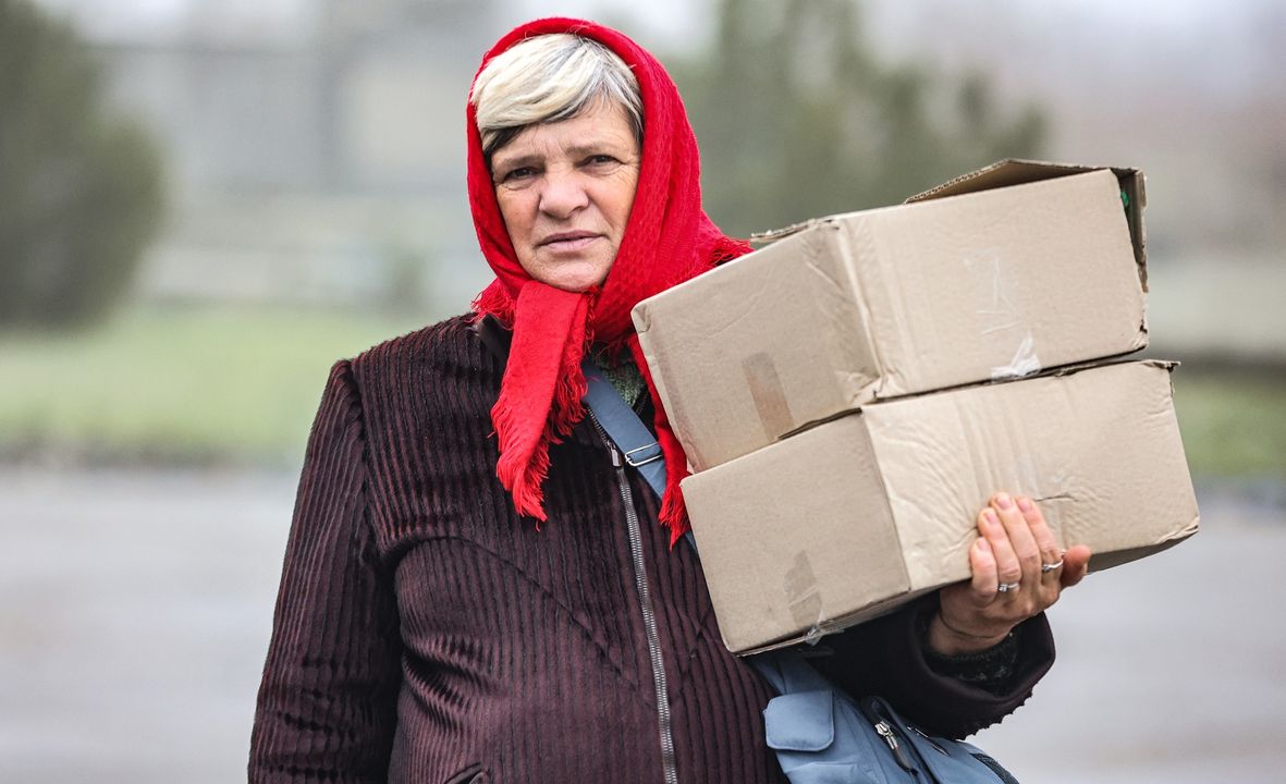 Ukrainian Senior With Two Boxes Of Humanitarian Aid Ukrainian Senior With Two Boxes Of Humanitarian Aid