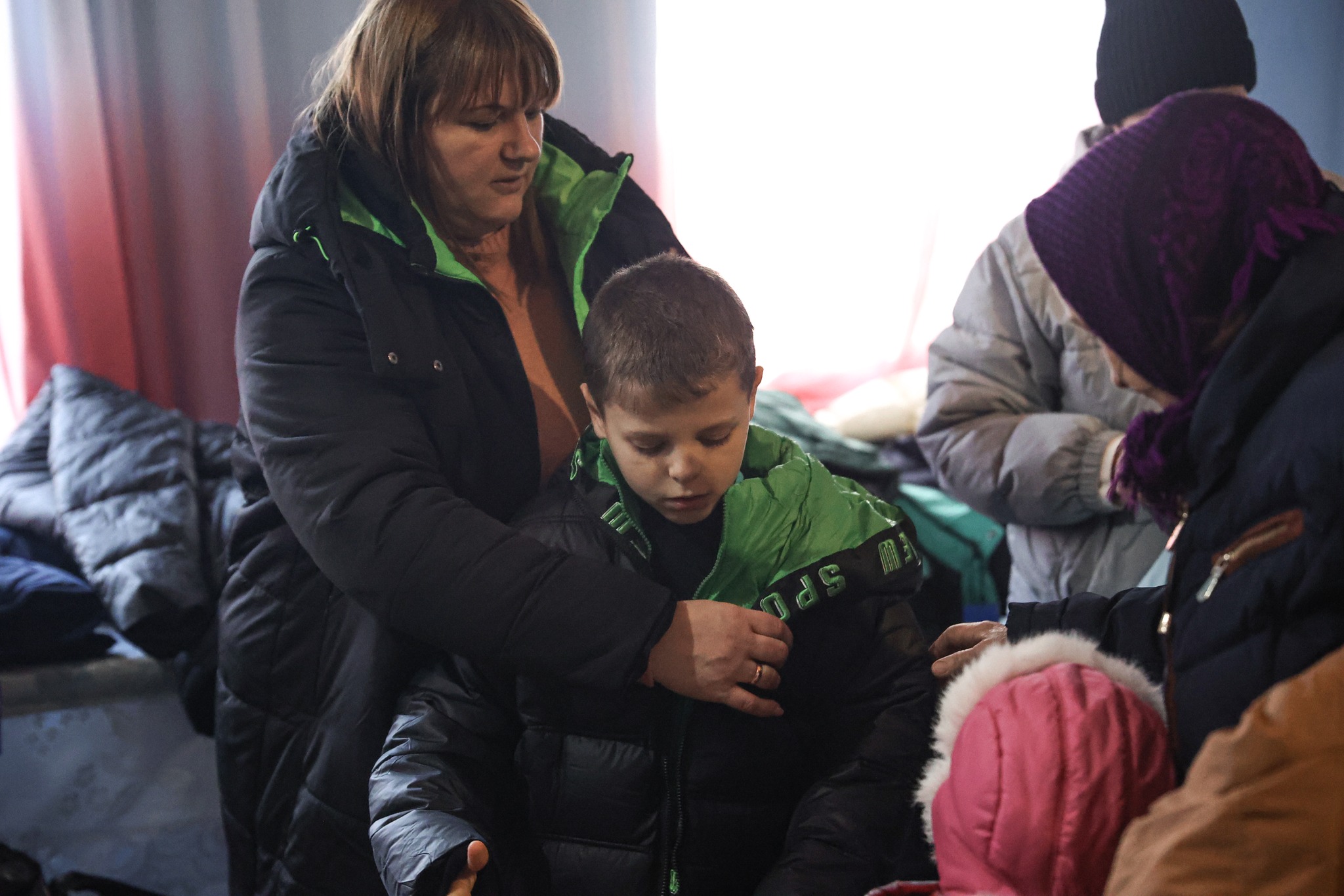 Ukrainian Boy Trying On Winter Clothes