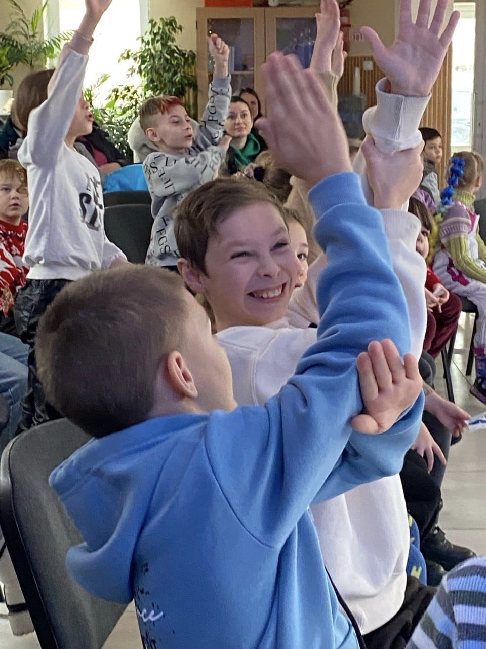 Ukrainian Children Raising Their Hand During Kids Club Ukrainian Children Raising Their Hand During Kids Club