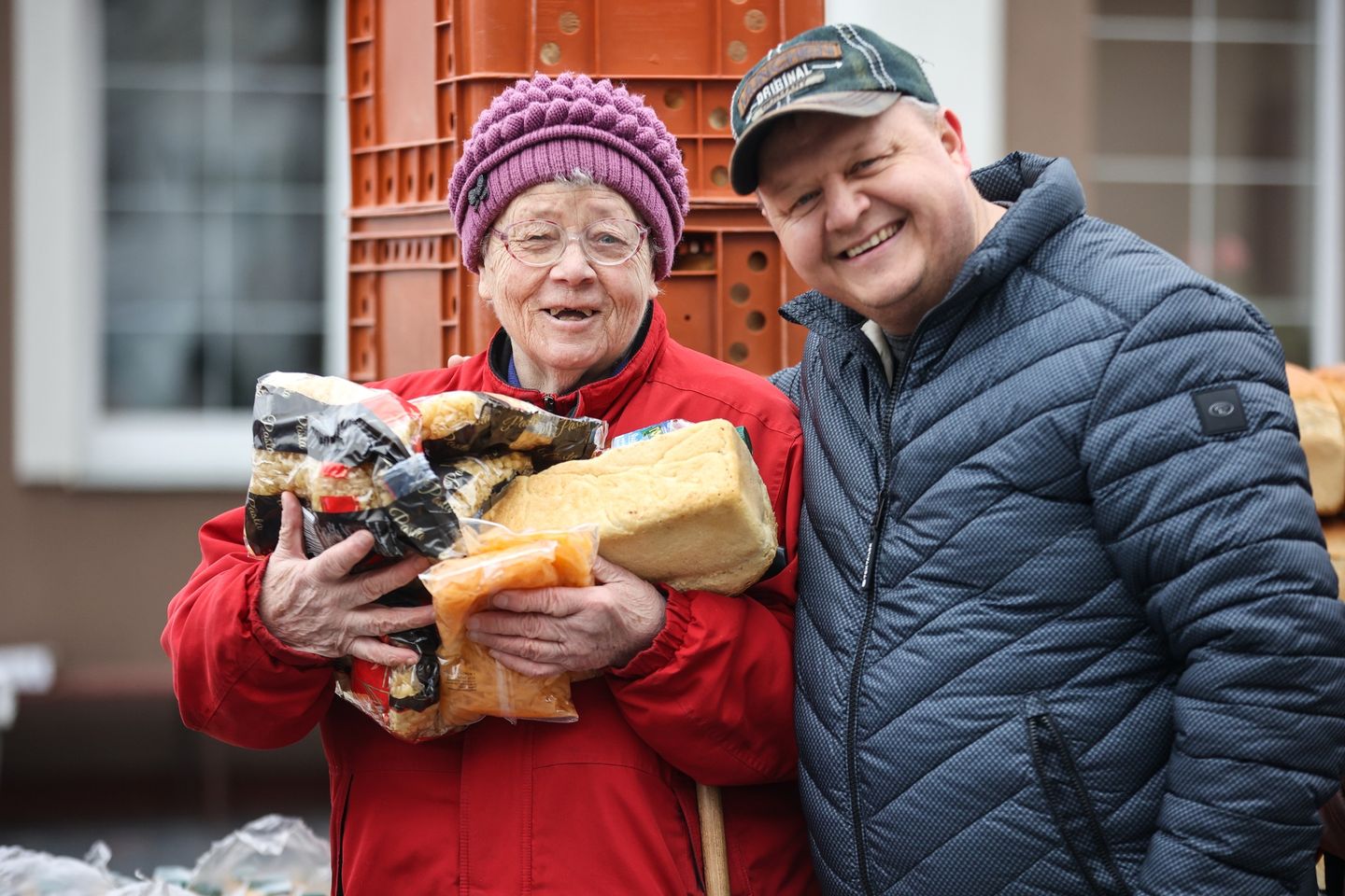 Pastor Of Uman Church Smiling With An Elderly Ukrainian Woman Holding Bread Pastor Of Uman Church Smiling With An Elderly Ukrainian Woman Holding Bread