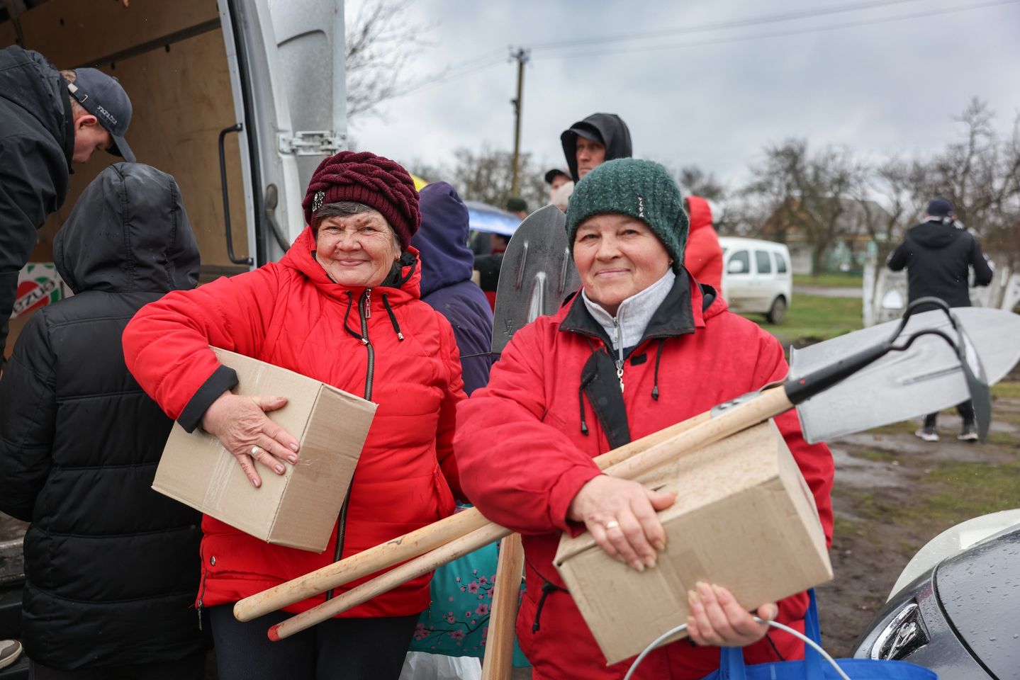Two Smiling Elderly Ukrainian Women Holding Boxes Given During The Distribution Of Aid Two Smiling Elderly Ukrainian Women Holding Boxes Given During The Distribution Of Aid