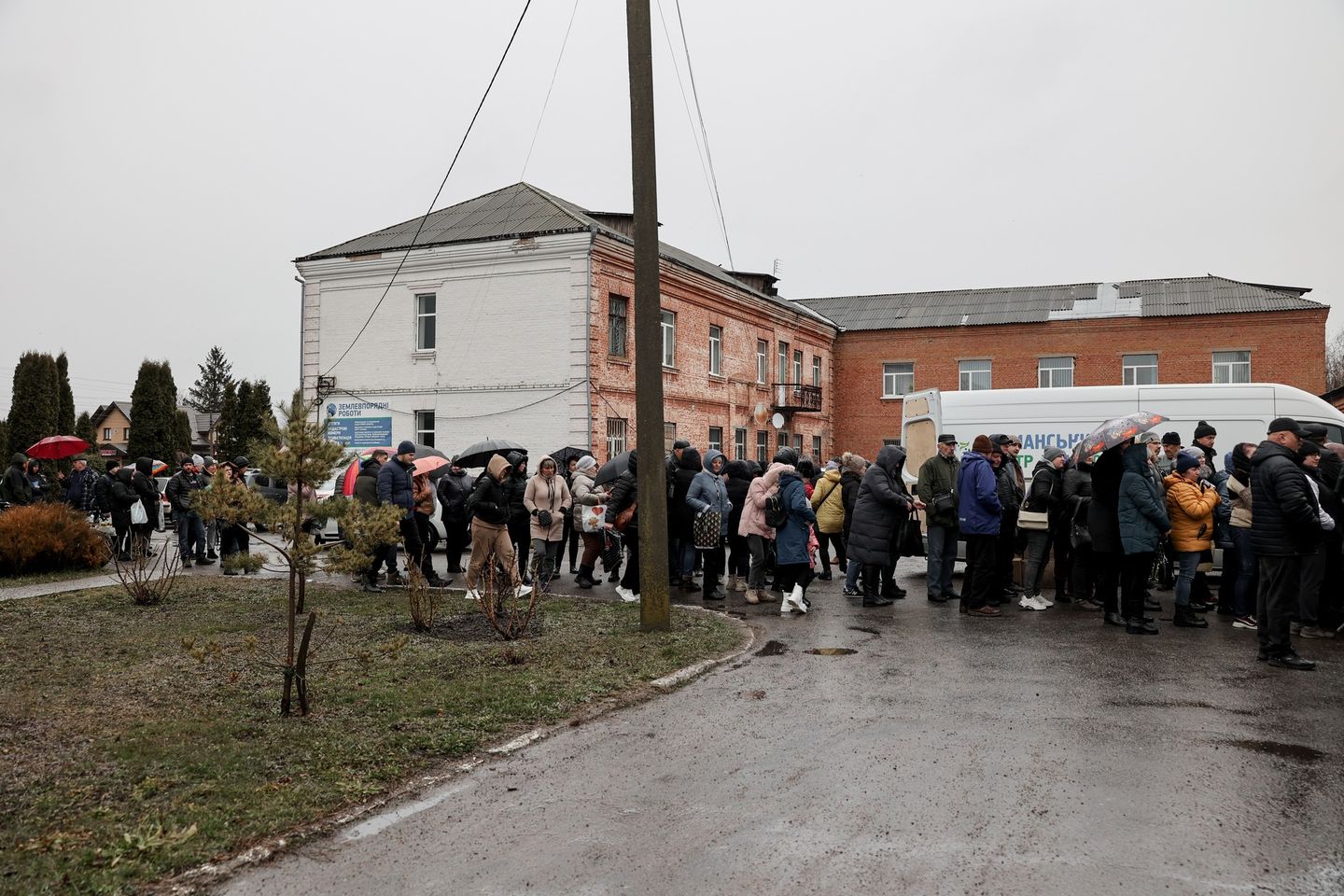 Crowd Gathered Around Aid Distribution Van In Ukraine Crowd Gathered Around Aid Distribution Van In Ukraine