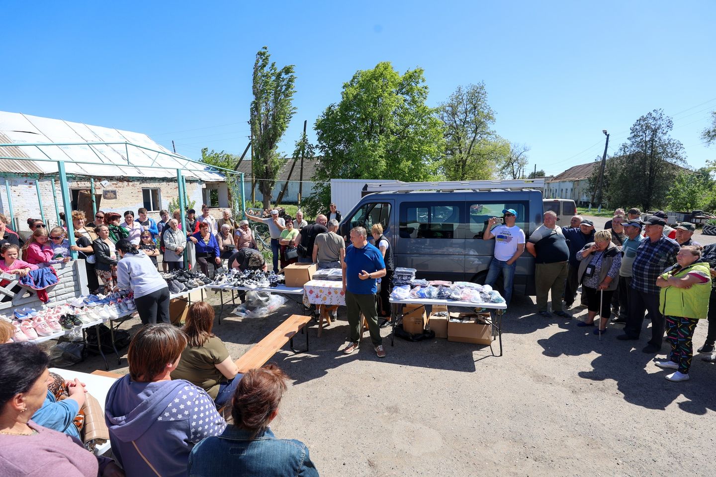 People Gathered Around Van With Humanitarian Aid In Kherson People Gathered Around Van With Humanitarian Aid In Kherson