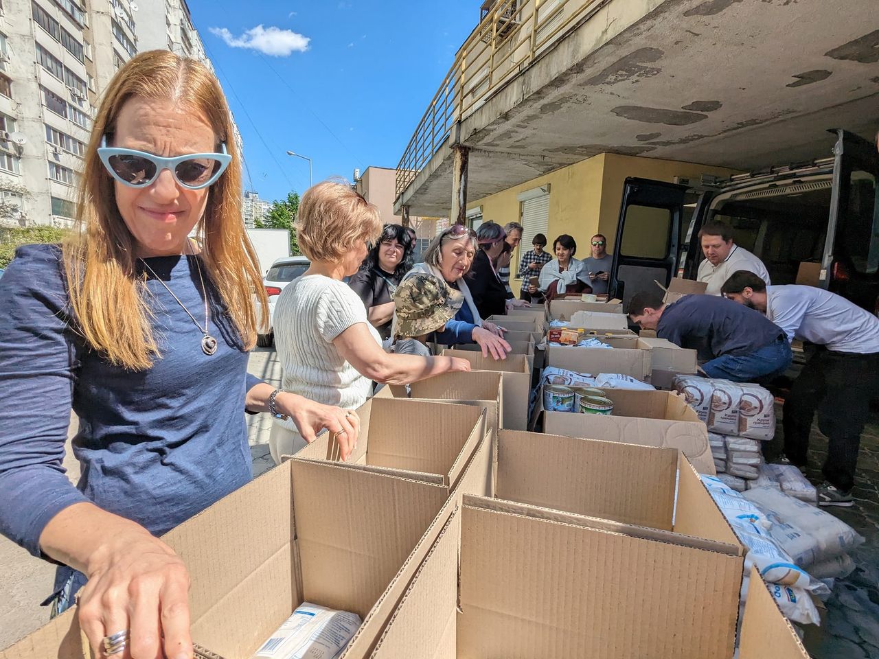 Volunteers With Boxes Ready To Be Filled With Food Volunteers With Boxes Ready To Be Filled With Food