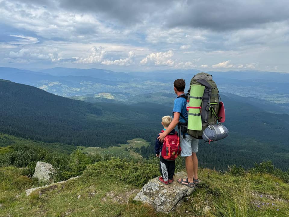 A Son And Father Looking At Karpaty Landscape A Son And Father Looking At Karpaty Landscape