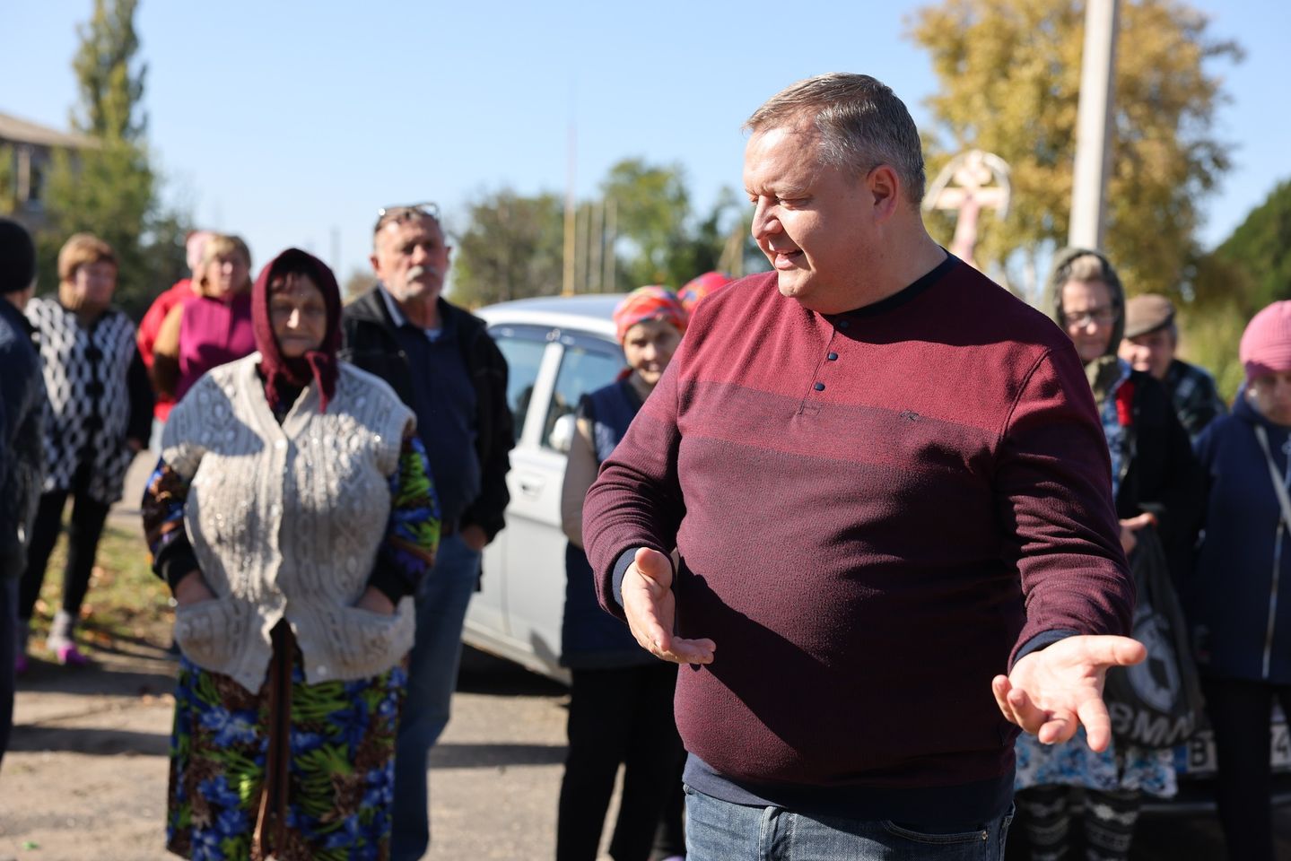 Uman pastor speaking to locals N