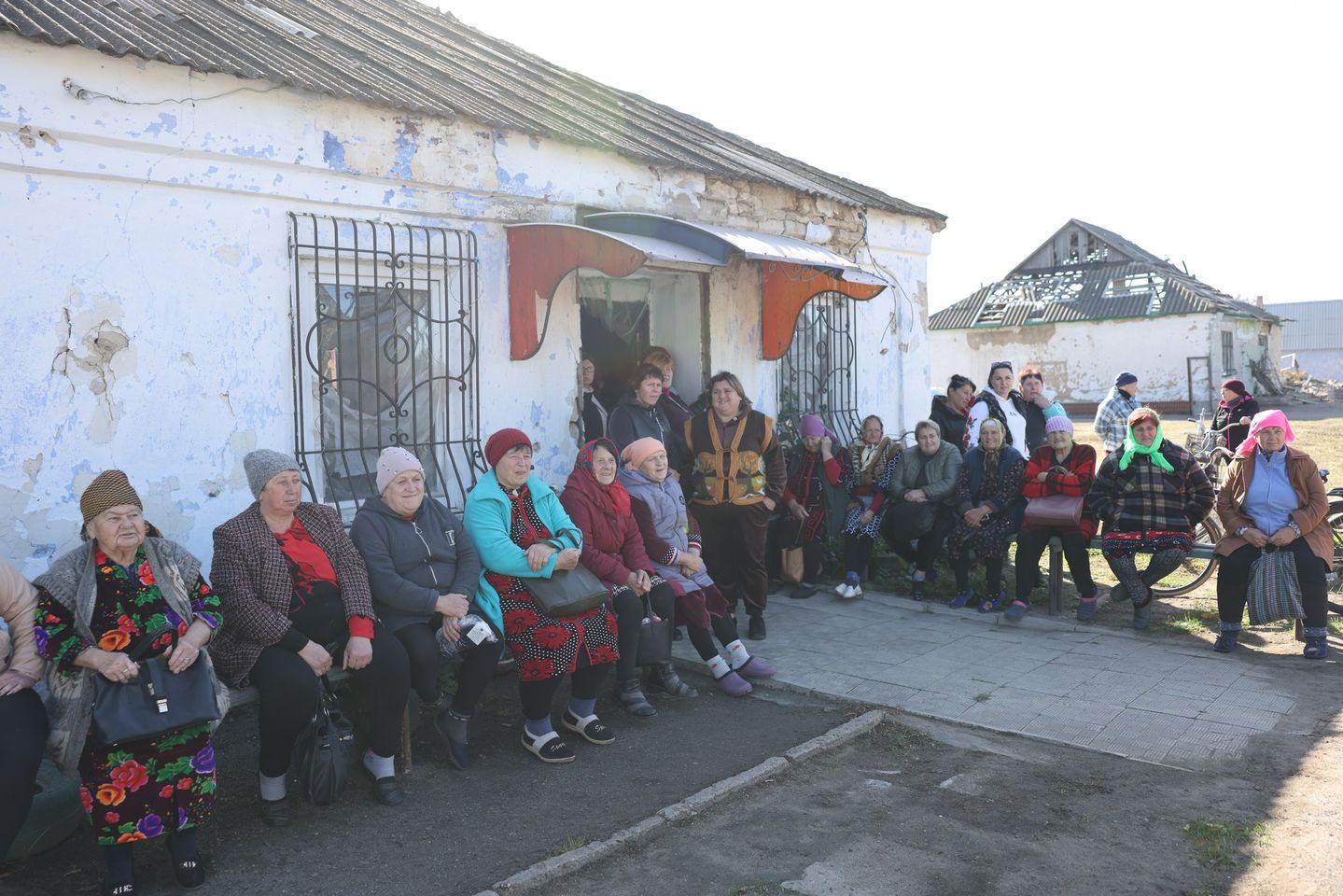 People from Ukrainian village waiting for distribution of aid N
