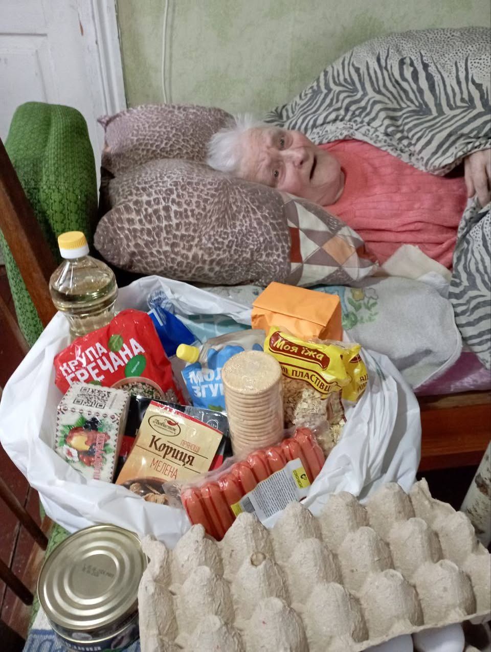 A Grocery Bag Has Been Brought To A Bed Ridden Senior Ukrainian Woman A Grocery Bag Has Been Brought To A Bed Ridden Senior Ukrainian Woman