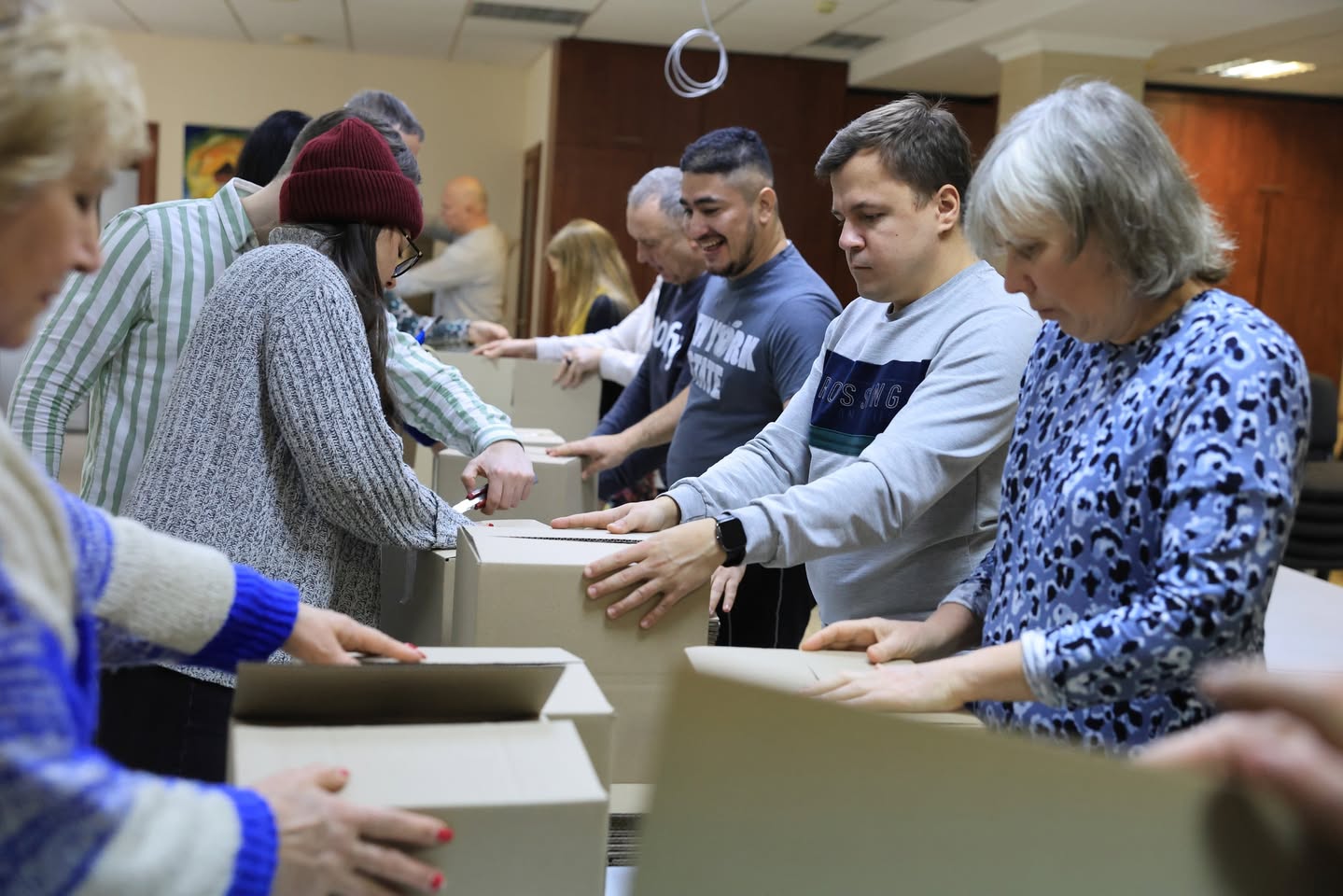 Lines Of People Preparing Boxes Lines Of People Preparing Boxes