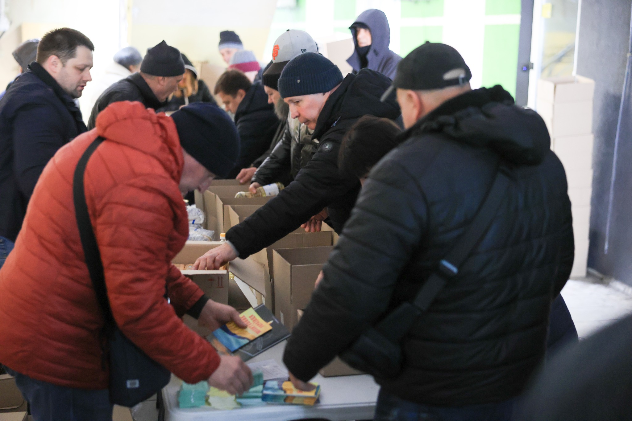 Lines Of People Putting In Products In Boxes Lines Of People Putting In Products In Boxes