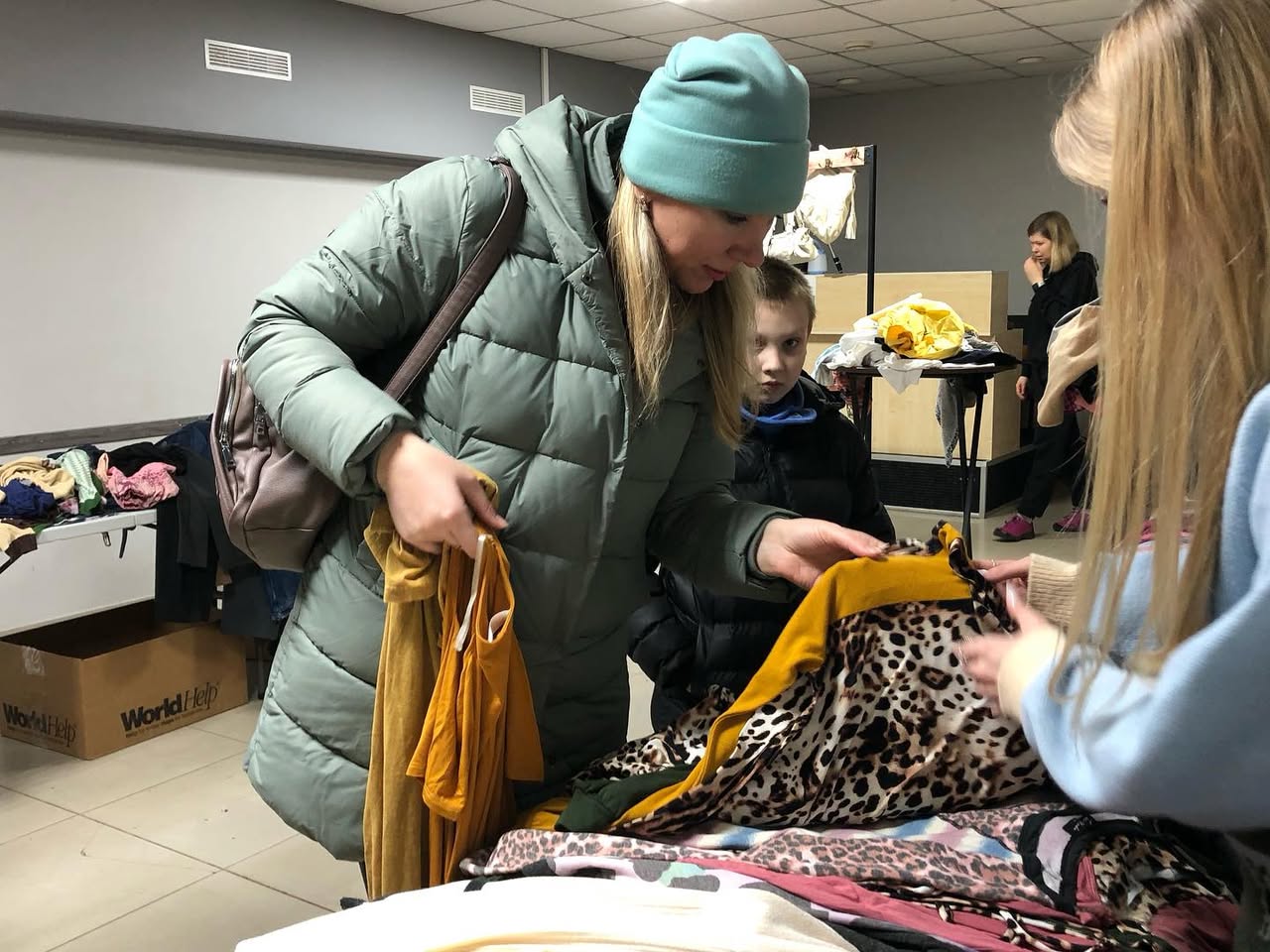 Ukrainian Mom With Her Son Picking Out Clothes Ukrainian Mom With Her Son Picking Out Clothes