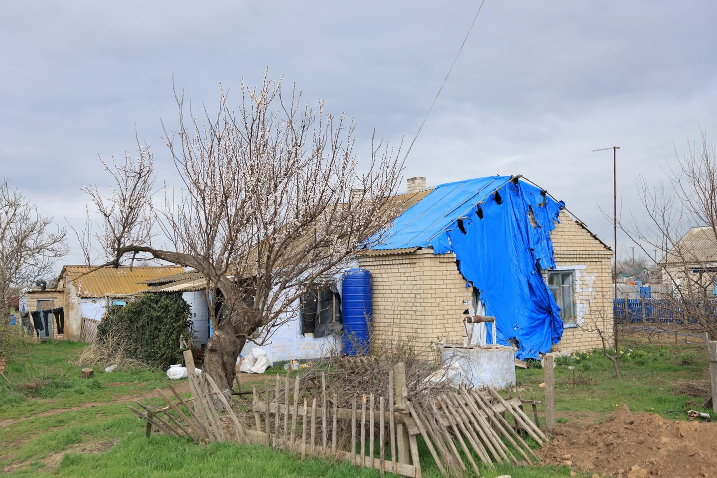 A Destroyed House Covered With A Tarp A Destroyed House Covered With A Tarp
