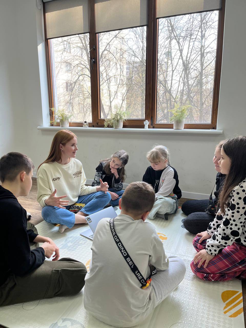 Moms And Kids Sitting In A Circle Moms And Kids Sitting In A Circle