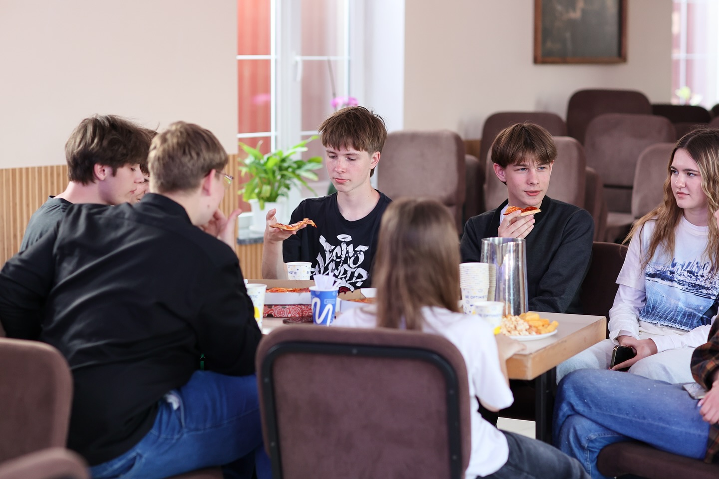Ukrainian Guys Eating Pizza
