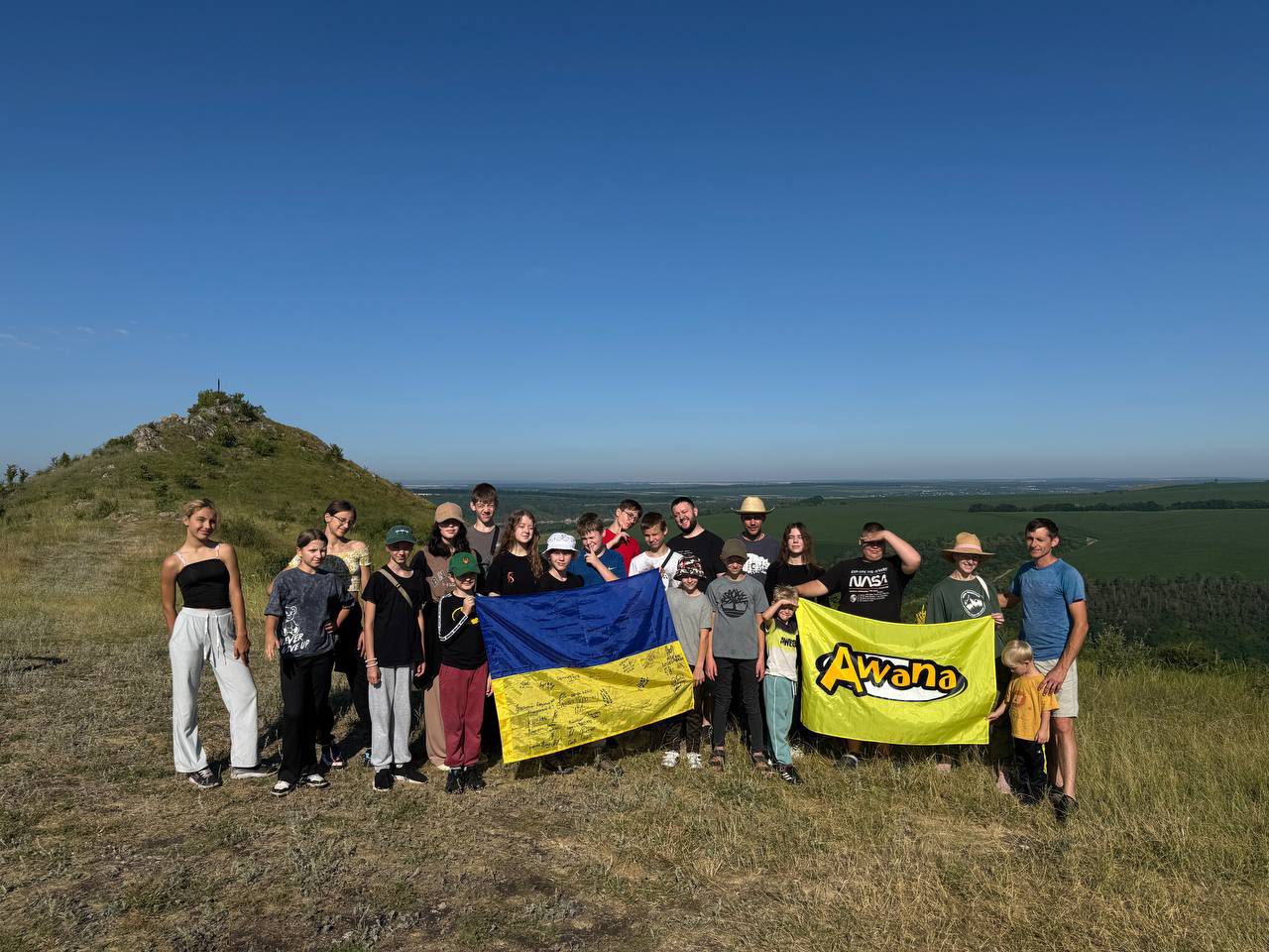 Quiet Harbor Leading A Group Of Young People On Hike In The Mountains July