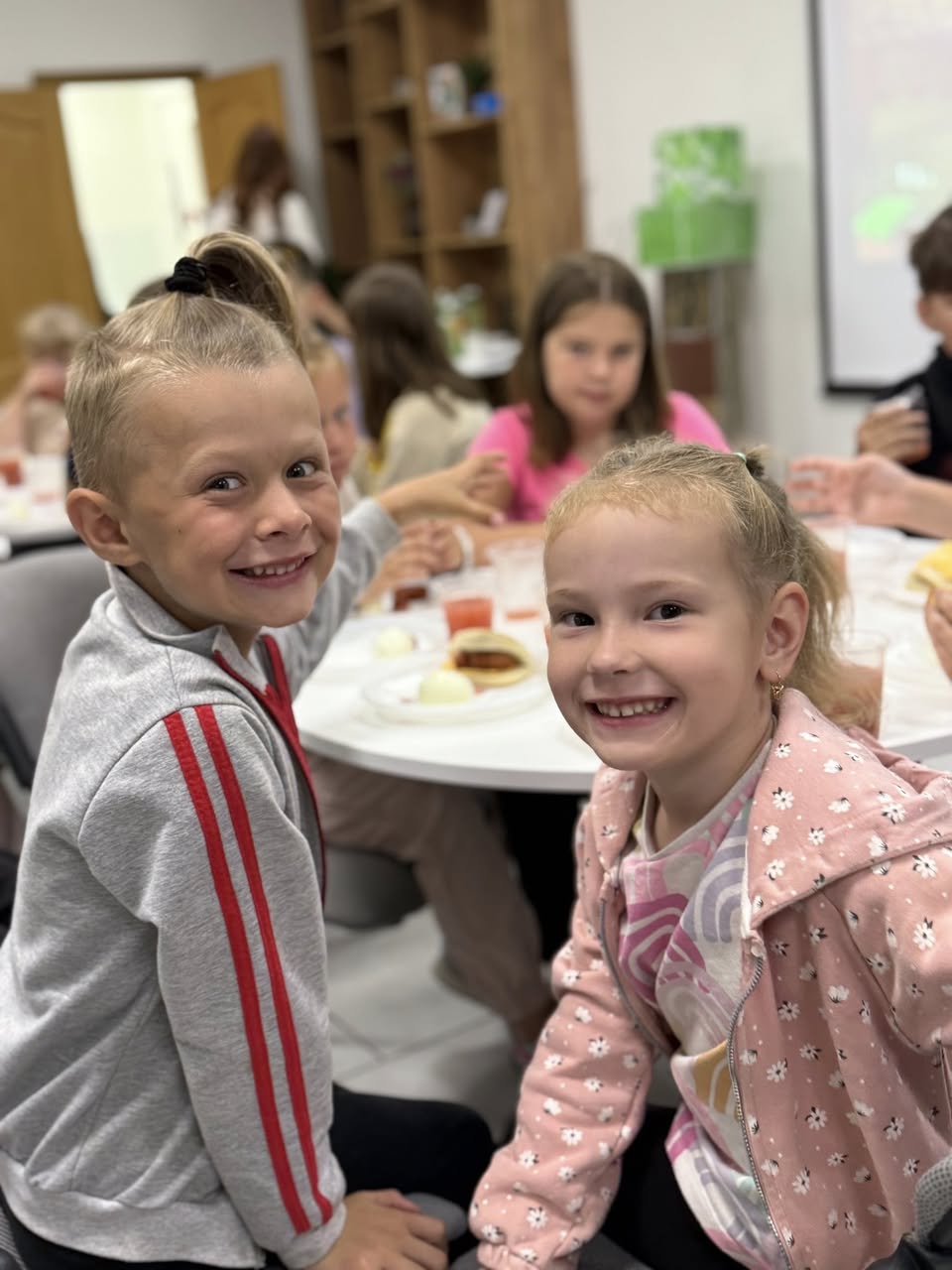 Smiling Children At Lunch Table