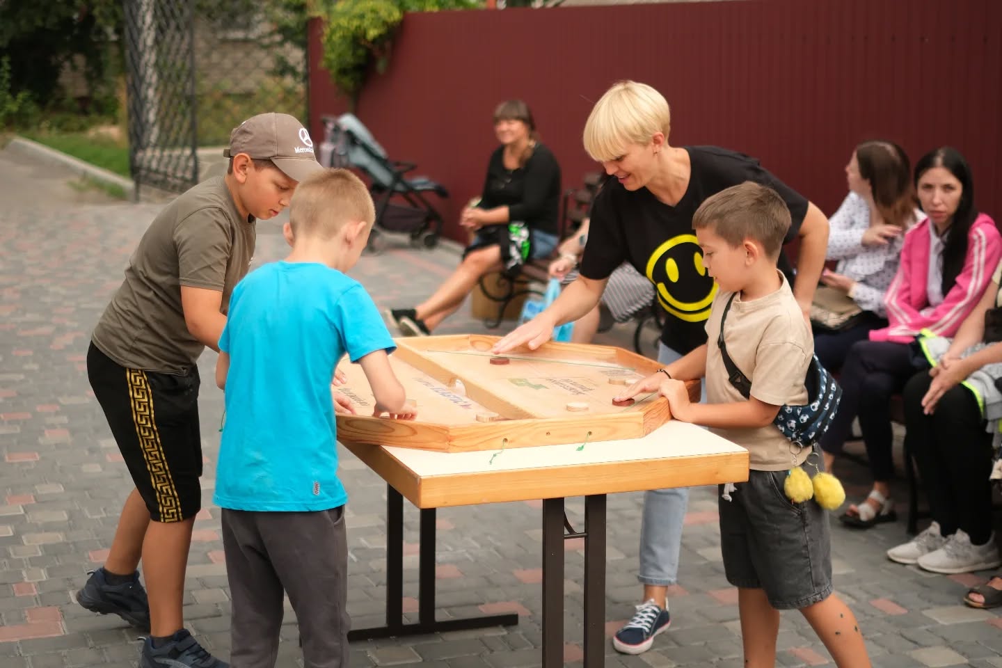 Ukrainian Boys Playing A Game O A Wooden Board Ukrainian Boys Playing A Game O A Wooden Board