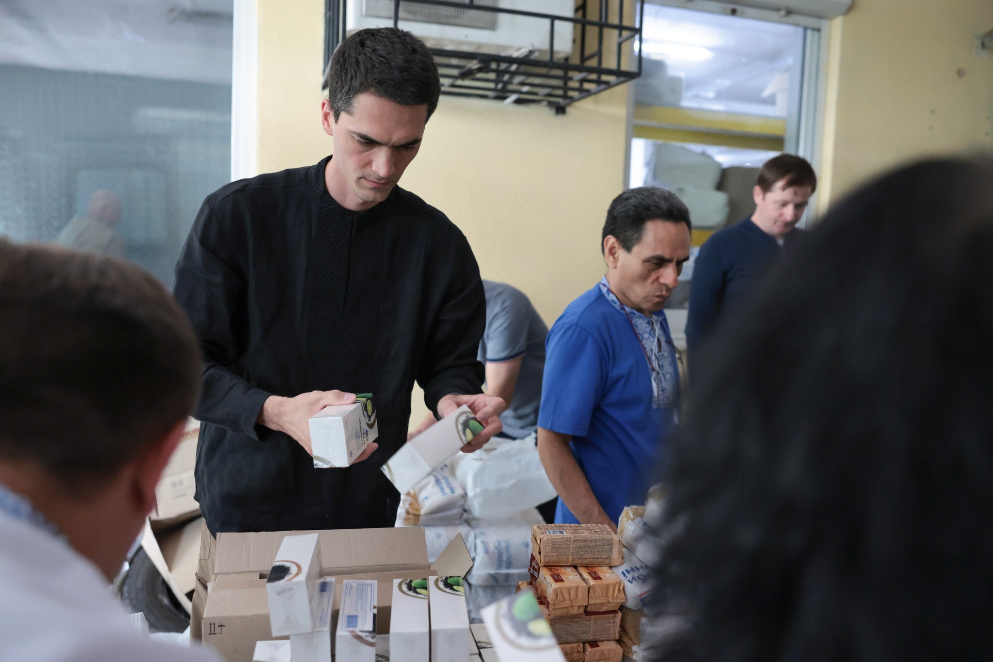 Ukrainian Man Packing A Box Of Aid Ukrainian Man Packing A Box Of Aid