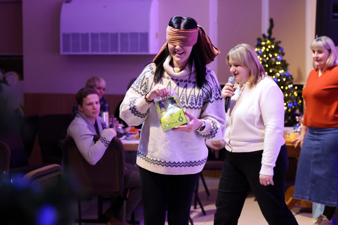 Parents Playing Game At Christmas Event