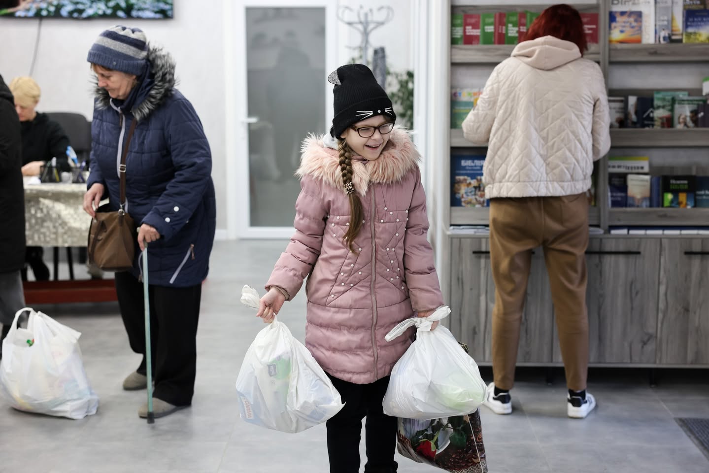 Ukrainian Girl Carrying Bags Of Humanitarian Aid