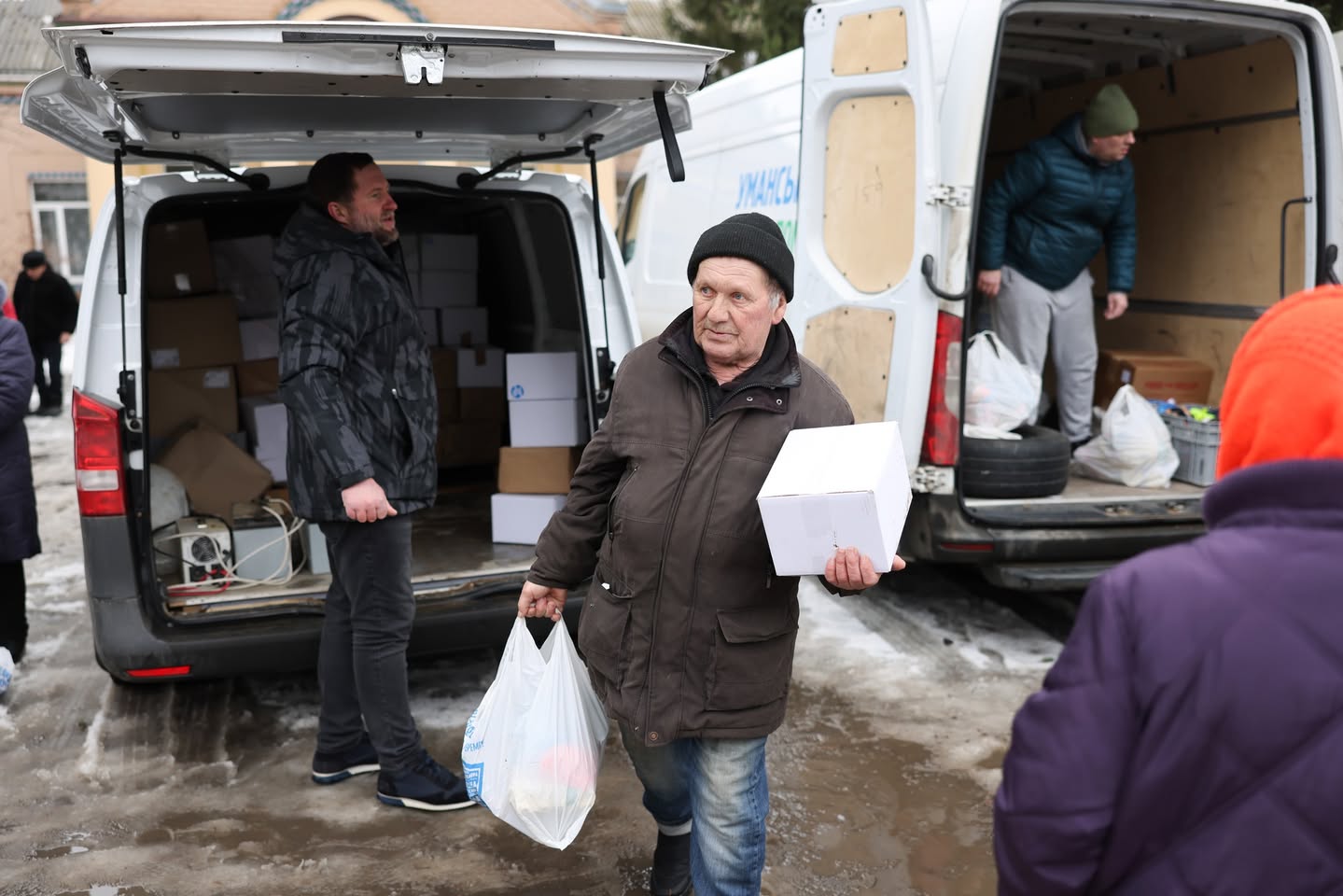 Ukrainian Man With A Bag And Box Of Humanitarian Aid Ukrainian Man With A Bag And Box Of Humanitarian Aid