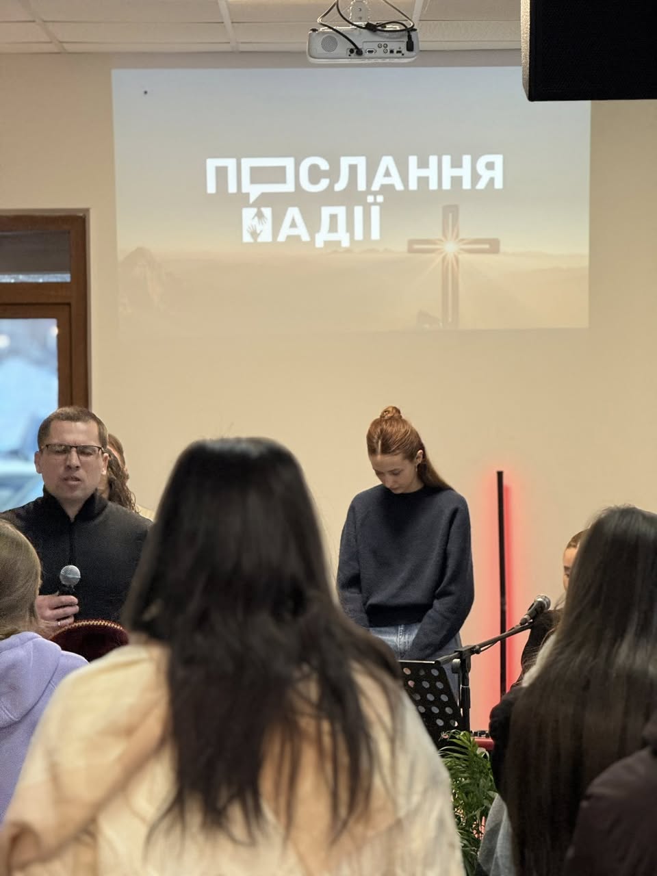 Ukrainian Woman Praying During Service