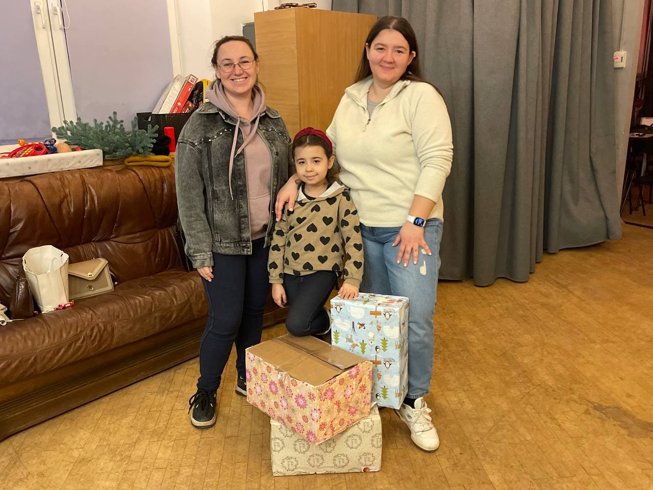 Ukrainian Women And A Child With Chrismas Presents Ukrainian Women And A Child With Chrismas Presents